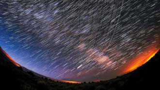 A timelapse image of satellite tracks in the sky.