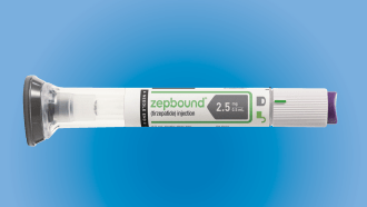 An injector of the weight loss drug tirzepatide, brand name zepbound, floating on a blue background.